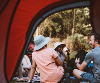 3 people hiking in the mountains with their First Ascent hiking gear