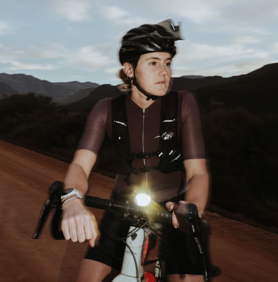 Ladies Ecuador Vent Cycling Jersey Lady wearing First Ascent's Vent cycling jersey while sitting on a bike