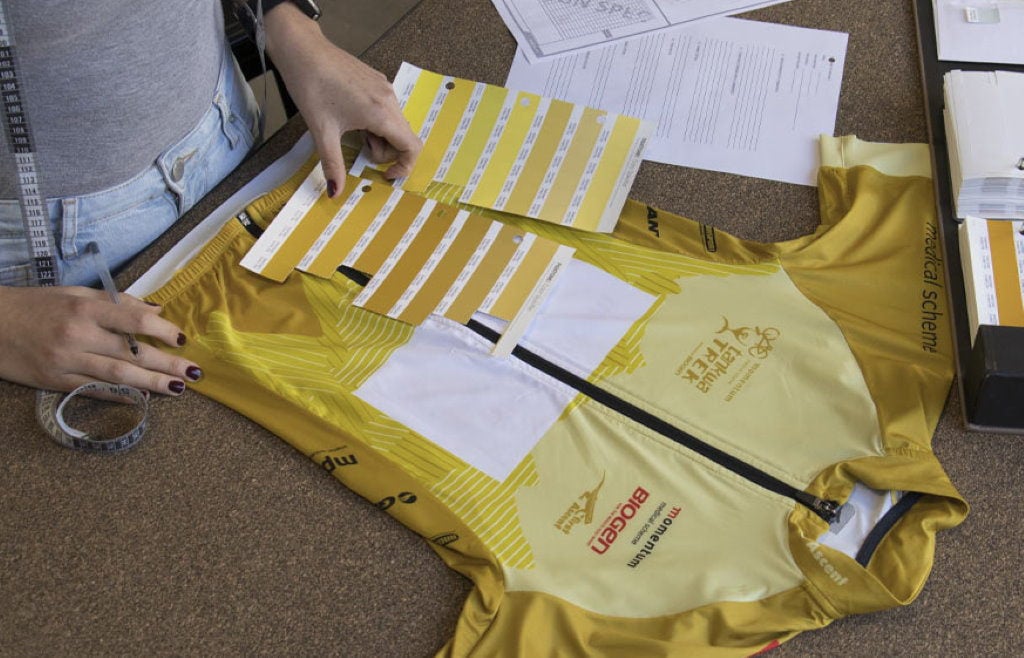 First Ascent designer looking at different pantone colours for custom cycling jersey