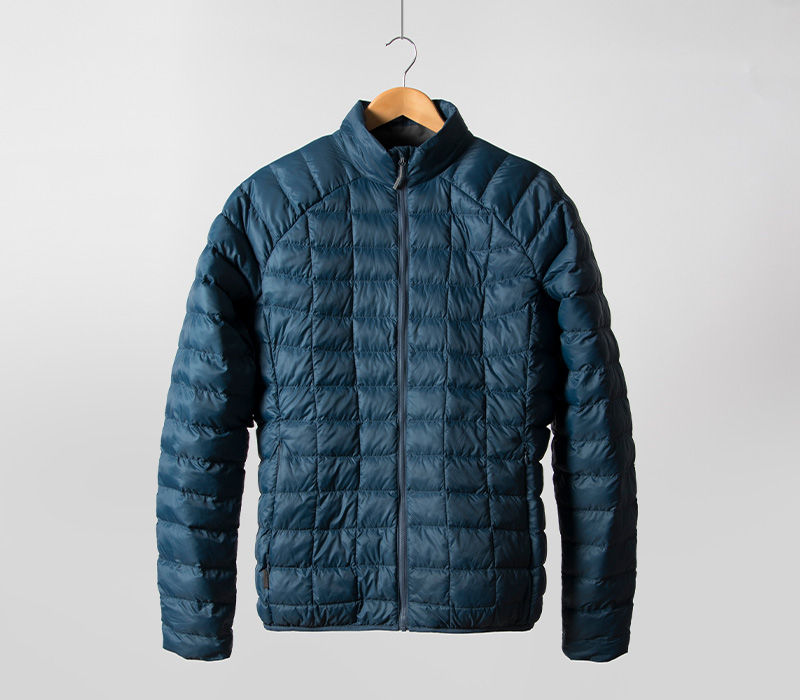 First Ascent Men's Aeroloft jacket hanging in the studio
